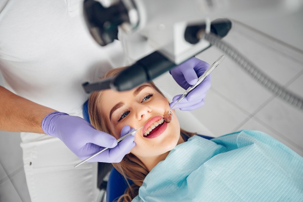 Beautiful girl sitting in the dentist office